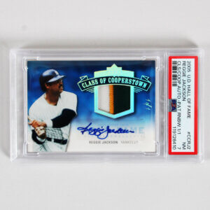 2005 U.D. Hall of Fame Reggie Jackson Graded Card #CCRJ2 CLS/COOP AUTO Pat-Rainbow 1/1 - PSA 7