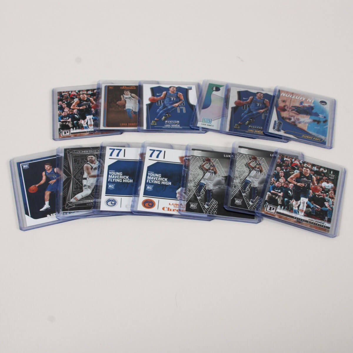Luka Doncic Card Lot of 13 Incl. (12) Rookies RC Incl. 2018-19 Panini Threads Icon Jersey Dazzle, Chronicles etc.